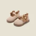 Elegant apricot fly-knit baby girl walking shoes featuring a decorative houndstooth flower - Pink