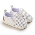 Detailed view of white PU leather infant walking shoes with breathable perforated design - White