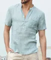 Close-up detail showing the mint green cotton linen fabric and henley collar of men's shirt - S / Tops / Light Blue