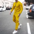 Detail view of a man wearing a bright yellow long-sleeved casual sports tracksuit - Yellow