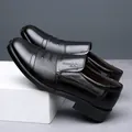 Detailed side view of black leather dress shoes showing texture and fine stitch details. - 38 / Slip-on (617) / Black