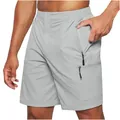 Detailed view of grey men's cargo shorts featuring functional side zipper pockets design - S / Bottoms / Light Gray