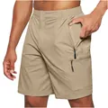 Close-up of men's khaki cargo shorts with multiple functional zipper pockets - S / Bottoms / Khaki
