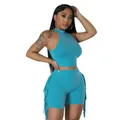 Close-up of the stylish fringe detail and vibrant turquoise fabric on the 2-piece set - Light Blue