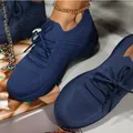 Detailed view of the navy blue breathable knit fabric on women's platform sneakers - Dark Blue