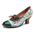 Close-up of vintage floral patchwork high heel pumps with green leather and bow detail - 36 / Green