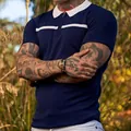 Detailed view of men's navy blue slim fit knit polo shirt with white contrast collar - Navy Blue