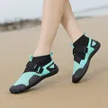 Mint green high-top water shoes for beach wading, featuring breathable mesh and non-slip soles. - Black Blue