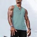 Close-up of men's ribbed henley tank top in light sage green with functional buttons - M / Tops / Aqua
