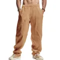 Detail view of men's loose khaki linen wide-leg trousers with drawstring waist - Earthy Yellow