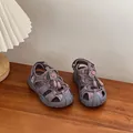 Close-up view of children's purple sports sandals on a wooden table with a soft lamp. - Size 32 Inner Length 20cm / Purple