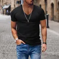Detailed view of men's casual black V-neck short sleeve t-shirt in street setting - Black
