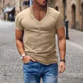 Men's casual V-neck solid khaki t-shirt captured in an outdoor street lifestyle scene - Khaki