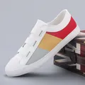 Stylish women's slip-on canvas shoes featuring colorful block patterns on a white base - 35 / Off White