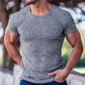 Macro view of men's athletic fit t-shirt with grey ribbed texture detail - M / Tops / Gray