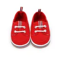 Rode canvas baby wandelschoenen met gestreepte accenten en witte decoratieve veters. - Rood