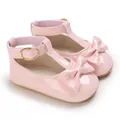 Detail view of pink patent leather baby shoes with decorative bow and gold buckle strap. - Inner Length 11cm / 64g / Pink