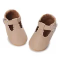Close-up detail view of beige baby Mary Jane shoes featuring soft soles and scalloped edges - Apricot