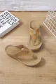 Close-up view of camel wedge flip-flop sandals featuring laser-cut hollow design details - 36 / Khaki