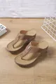 Close-up of brown wedge flip-flop sandals with hollowed-out patterns and metallic accents - 36 / Brown