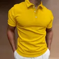 Close-up detail of a bright yellow slim fit men's polo shirt with white buttons - Yellow