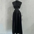 Elegant black sleeveless maxi dress with waist cut-out and high neck design detail - Black