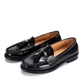 Detail shot of black patent leather tassel loafers for men with a polished finish. - 37 / Black