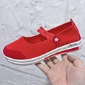 Side view of red flyknit Mary Jane wedge shoe with star logo and white sole detail - 35 / Red