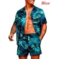 Close-up of men's blue tropical floral print Hawaiian shirt and shorts set on model - S / Top And Bottom / Set 13