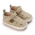 Detailed view of khaki canvas baby shoes featuring soft non-slip rubber soles - Apricot