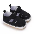 Close-up of black classic baby canvas sandals with soft non-slip rubber sole and velcro strap - Black