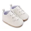 Detailed close-up of white baby soft sole sneakers featuring litchi grain leather texture - 11cm/64 / White