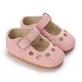 Close-up of pink baby princess shoes with heart-shaped cutouts and t-strap buckle - 11cm/64 / Pink