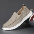Men's stylish khaki slip-on loafers featuring breathable canvas and flexible soft white soles - Khaki