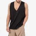 Detail view of a man wearing a black sleeveless V-neck tank top in a studio setting - S / Tops / Black