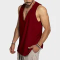 Men's deep V-neck burgundy cotton tank top with a relaxed fit, shown on a model. - S / Tops / Burgundy