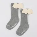 Close-up of grey ribbed baby socks with plush angel wings and non-slip soles. - S / Heather Grey (DB032)