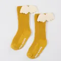 Close-up of yellow ribbed baby socks featuring cute 3D plush white wing decorations - S / Ginger (DB032)