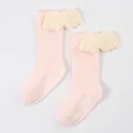 Close-up detail of pink ribbed baby socks featuring plush angel wings and non-slip grips. - S / Pink (DB032)