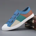 Stylish men's casual low-top canvas sneakers with a vibrant multi-color block design - Aqua Blue