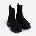 Detail of black breathable knit sock boots featuring chunky platform soles for women - Black