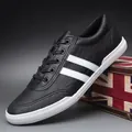Classic black men's casual sneakers with white stripes and breathable low-top design - 38 / Black & White (8152)
