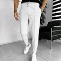 Detailed view of men's white waffle knit casual joggers with a drawstring waist. - M / Bottoms / White