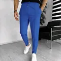 Detailed view of men's blue waffle knit casual pants featuring drawstring waist and seam. - M / Bottoms / Sapphire Blue