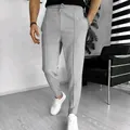 Men's waffle texture casual drawstring trousers in light grey shown in a modern interior - Light Gray