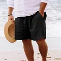 Vue détaillée du short respirant en coton et lin noir pour homme dans un décor de plage - S / Bas / Noir