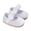 Elegant white baby girl baptism shoes with decorative large bows and soft soles. - White