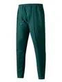 Dark green men's waffle knit jogger pants featuring drawstring waist and pintuck detail - Dark Green