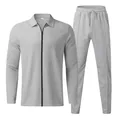 Macro view of men's light gray waffle knit tracksuit set with zipper top and pants. - Light Gray