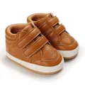 Detailed view of brown leather baby toddler shoes with velcro straps and breathable holes - Tan